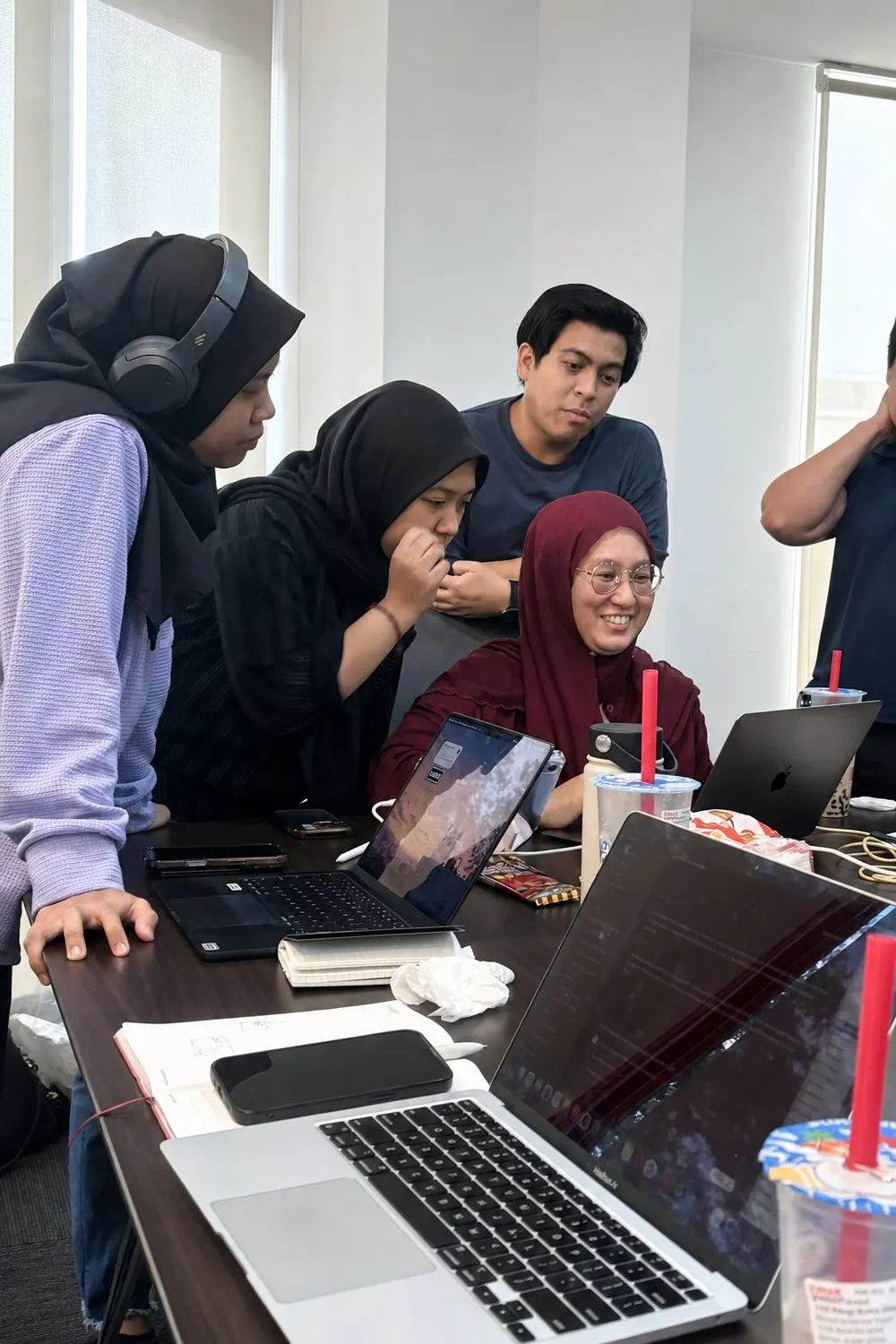 Participants working together at laptops during the AI for Business workshop