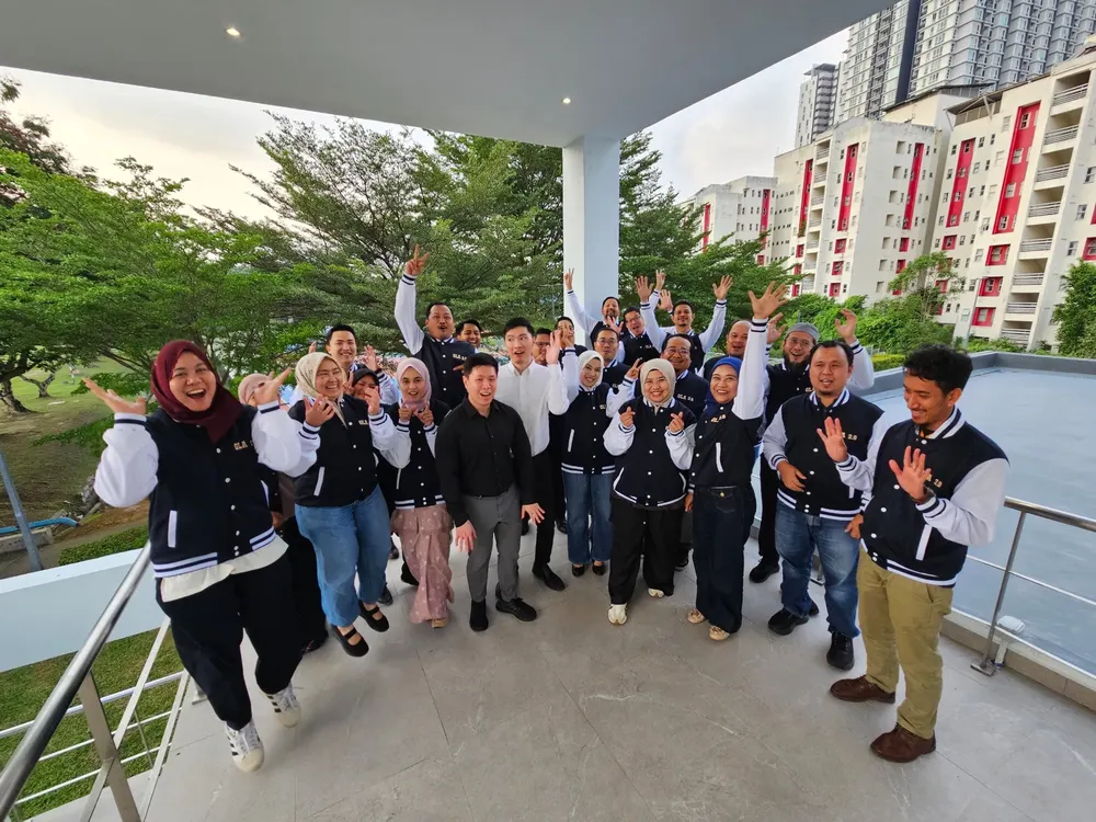 TNB AI leadership cohort cheering outdoors after the workshop