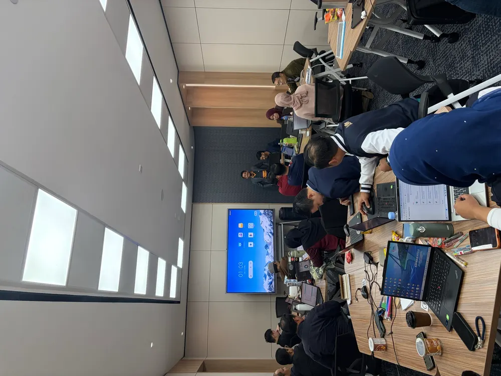 TNB participants building at laptops during the hands-on block